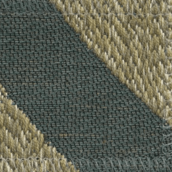 Woven fabric texture with geometric diagonal stripes in olive green and sandy beige, displaying dense and raised weave details.