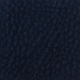 Dark blue nubuck texture fills the frame, displaying a dense, uneven surface with subtle tonal variations and a raised, nubby quality.