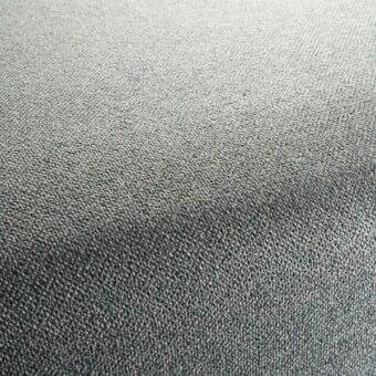 Muse 052 fabric texture, gray gradient, dense woven granular surface with raised dots, Bizzotto Nara collection textile sample.