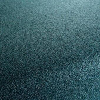 Teal fabric texture with short, dense pile and granular surface; matte finish, subtle mottled tone, durable weave; Bizzotto Muse 082.