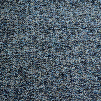 Textured fabric sample in dark gray, charcoal, and blue tones displays a granular, woven pattern with a matte finish.