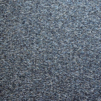 Agata fabric sample by Bolzan Letto, blue granular texture, speckled surface with gray and off-white tones, woven construction.