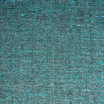 Teal tweed fabric texture with silver and turquoise flecks, dense woven structure, studio shot with product label “bolzan letti azalea 111”.