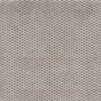 Gray velvet fabric texture with repeating geometric pattern, exhibiting a raised, nubby surface and soft, plush pile; Bolzan Leti "606".
