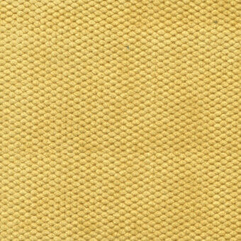 Golden yellow velvet texture with repeating circular nodes in a grid pattern, displaying a soft sheen and woven looped construction.
