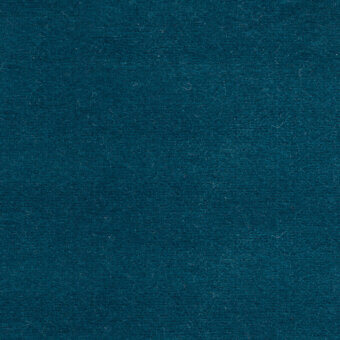 Teal fabric sample with dense pile and matte finish, displaying “bolzan letti” label, even lighting, tight weave, and subtle tonal variations.