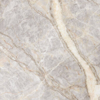 Fior di Pesco marble texture with cool gray base, creamy white veins, polished finish, and natural fissures creating a dynamic, muted pattern.