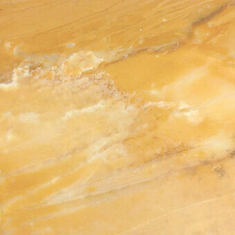 Giiallo Siena marble slab displaying golden-yellow base with cream and white veining, polished finish, and subtle translucency.