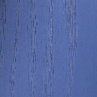 Painted wood texture in azzurro guado, displaying vertical grain and a matte finish with subtle color variations.