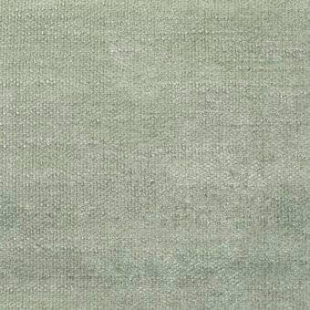 Pastel green woven fabric sample with a matte finish, displaying subtle tonal variations and a densely textured, tactile surface; label reads “bonaldo.”