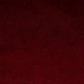Red Azimut fabric sample with a dense, granular texture and subtle tonal variations, model 9b36 from Bonaldo’s fabric collection.