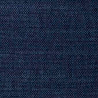 Navy blue fabric sample displaying a dense, dotted weave pattern with granular texture, suitable for upholstery applications.