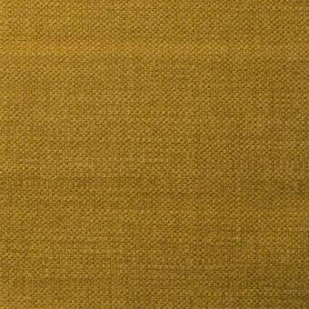 Mustard yellow fabric sample with a dense, textured weave and matte finish; small grid pattern with tonal variations and a label reading “bonaldo creta 9a76”.