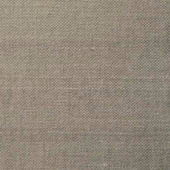 Beige woven fabric texture with a heathered, nubby surface and repeating geometric pattern; studio shot with brand text imprint.