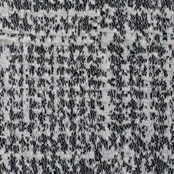 Galles fabric SA60 by Bonaldo, black and off-white woven textile with irregular, mottled pattern and subtle sheen.