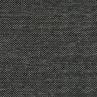 Charcoal gray woven fabric with a dense texture and speckled pattern of lighter gray, exhibiting a matte, non-repeating granular composition.