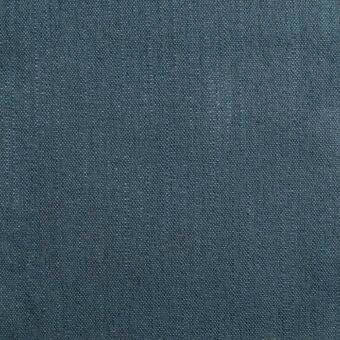 Teal woven fabric sample with a heathered texture, displaying a plain weave grid and matte finish; labeled “bonaldo flora md34”.