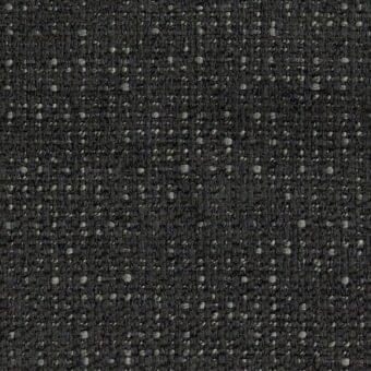 Charcoal gray textured fabric sample with scattered light gray dots, dense weave, and slightly raised nubby surface for upholstery applications.