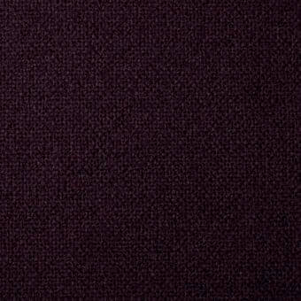 Plum woven fabric texture with looped pile, matte finish, and a granular surface; white label reads "bonaldo fabrics rico ma10".