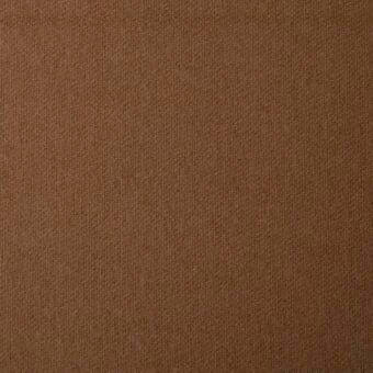 Brown fabric texture with a dense, nubby weave and matte finish, displaying subtle directional pile and visual depth in a studio setting.