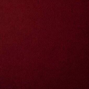 Burgundy knit fabric swatch with matte finish, displaying “bonaldo fabrics st moritz mc69” label, even lighting, subtle vertical ribbing.