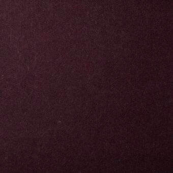 Burgundy wool fabric swatch with heathered texture, tight weave, and clean edges; label reads “bonaldo fabrics fabric (must) st moritz mc72”.