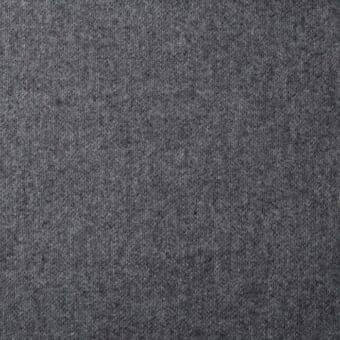 Gray woven fabric texture with directional pile, heathered tonal variations, matte finish, “st moritz” and “mc81” imprinted.