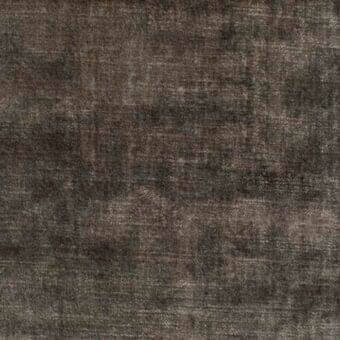 Charcoal gray woven fabric texture, “Vegas” (MB04) by Bonaldo, displays a matte, compact weave with subtle tonal variations and a distressed appearance.