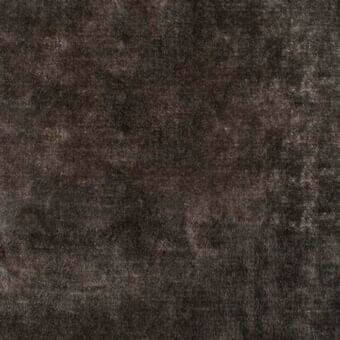 Charcoal gray textured fabric with a dense, mottled pile and subtle beige highlights, displaying an irregular, organic surface texture.