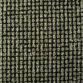 Brionne fabric sample, black and olive green, features a dense grid of rounded, textured elements with a looped pile construction.