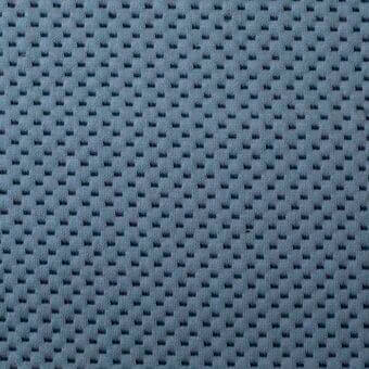 Blue-grey knitted fabric texture, Bonaldo “Cookie” collection, features repeating circular raised motifs in a grid pattern, matte finish.