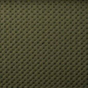 Olive-green knit fabric displays a dense, repeating raised square pattern with a matte finish and subtle waffle texture; SP44 collection.