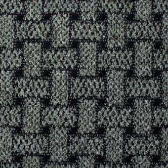Gray woven textile with a grid pattern of dark lines against a nubby background, looped texture, studio shot.