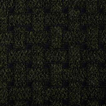Woven fabric texture with repeating geometric pattern in muted olive green and deep black, displaying a dense, slightly irregular square motif.