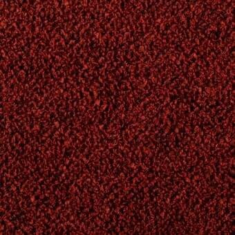 Rust-red looped pile fabric texture with granular appearance, varying loop heights, and tonal shifts; Bonaldo Rella SP02 textile sample.