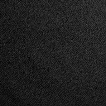 Black leather texture sample displaying a dense grain, irregular creases, and matte finish; Capri collection by Bonaldo, l09 leather.