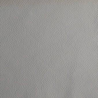 Capri leather texture sample, light gray, matte finish, displaying dense irregular grain patterns and a subtly wrinkled, organic surface.
