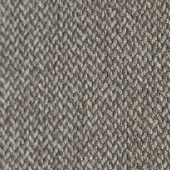 Herringbone fabric texture, muted gray tones, dense weave with visible threads and a repeating diagonal ridge pattern, matte finish.