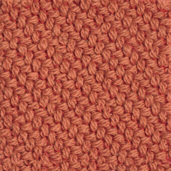 Woven fabric texture, muted salmon color, dense grid pattern; kvadrat coda collection, upholstery material sample with matte finish.