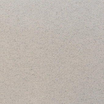 Granular texture, pale grey tone, matte finish, irregular particles create a rough surface, studio shot, uniform background, subtle gradient.