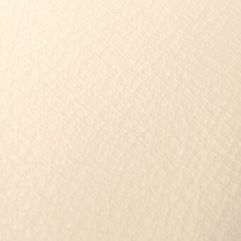 Ivory nappa leather texture with a granular surface, featuring small indentations and a matte, slightly pebbled appearance.