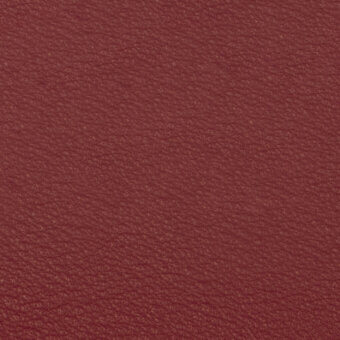 Nappa leather texture in oxide red displays a granular surface with warm undertones, natural grain, and subtle creases indicating suppleness.