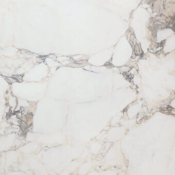 Glossy supermarble surface, white with grey-black veining, displaying swirling organic patterns and a polished, reflective sheen.