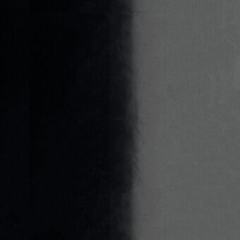 Lacquered metal gradient, black to gray, displays textured m327 glossy finish; vertical composition with diffused tonal transition.