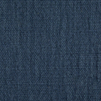 Blue-gray woven fabric texture with granular particles, uniform distribution, and subtle tonal variations; sample labeled “suvereto g307”.