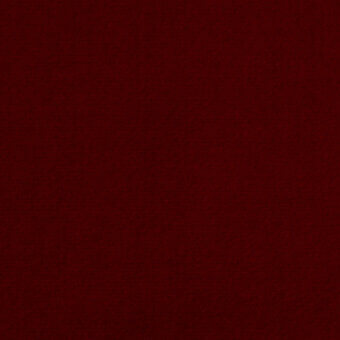 Deep crimson velvet fabric with a short pile and woven texture, displaying a rich, saturated color and even lighting throughout the frame.