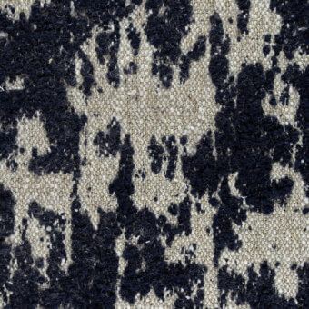 Woven fabric texture, navy blue and beige mottled pattern, irregular shapes with visible yarn loops, “borzalino bibbona g306” label.