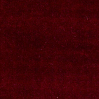Red velvet fabric texture with a dense pile, displaying a granular surface and rich crimson tones; Borzalino Boss velvet, 5019.