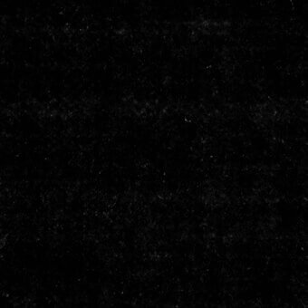 Black velvet fabric sample displaying a dense, short pile texture with subtle tonal variations and a slight sheen, labeled “Boss Velvet – 5022”.
