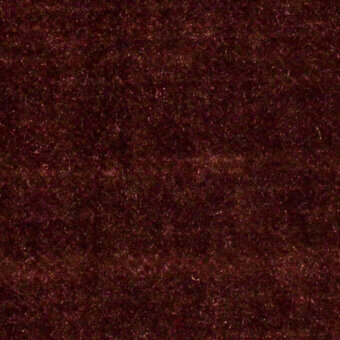 Burgundy boss velvet fabric texture with a dense, plush pile and subtle sheen, displaying a slightly raised, irregular surface.
